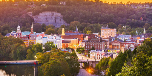 Frankfort, Kentucky, USA town skyline on the Kentucky River at dusk.